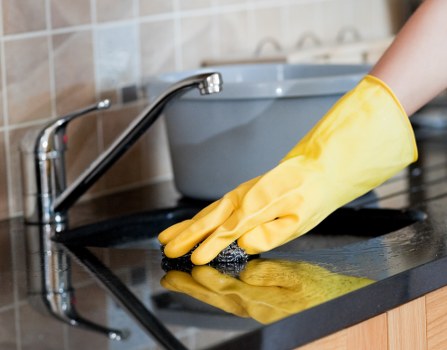 Technician completing a carpet cleaning inspection and risk assessment