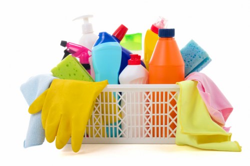 Professional carpet cleaner applying a chemical safety procedure