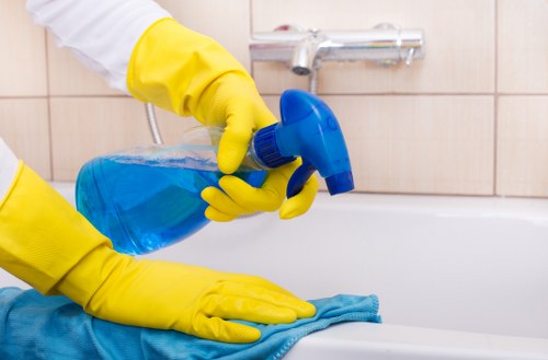 Technician performing deep sofa cleaning in Arkley on a living room couch
